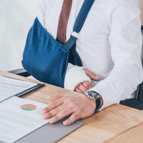 A business man with a broken arm.