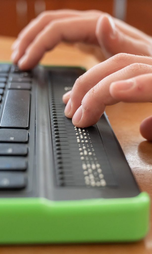 person using braille keyboard